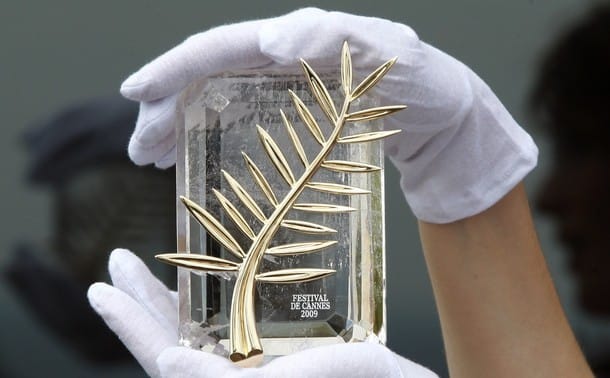 A Chopard representative displays the Palme d'Or in Cannes