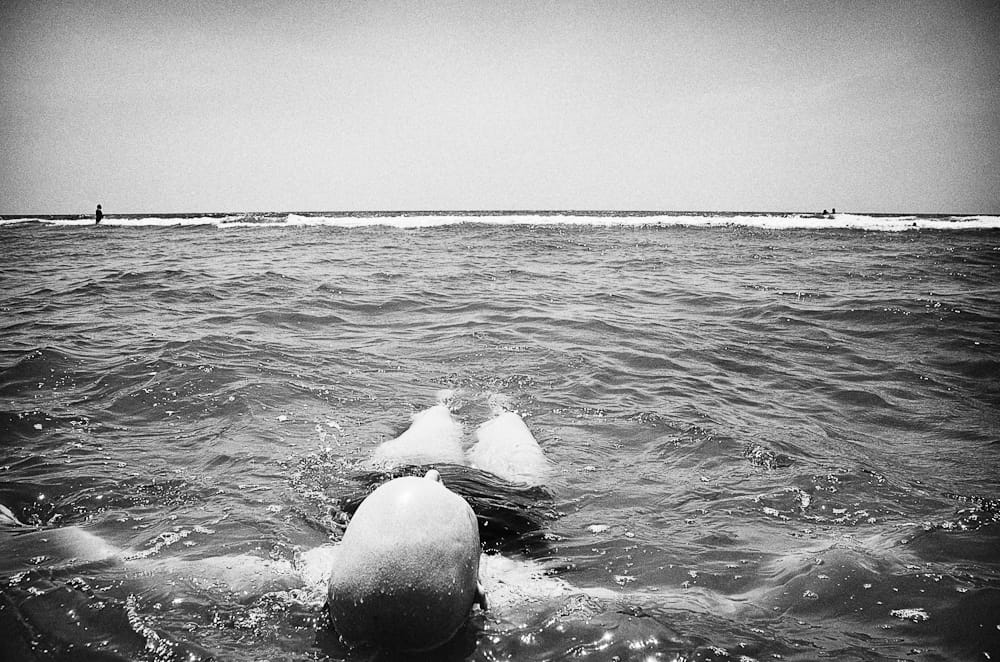 Jen floating in the ocean