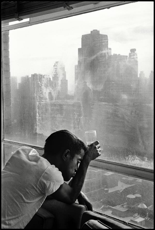 USA. New York City. 1959. Sammy DAVIS Jr. looks out a Manhattan window. Contact email: New York : photography@magnumphotos.com Paris : magnum@magnumphotos.fr London : magnum@magnumphotos.co.uk Tokyo : tokyo@magnumphotos.co.jp Contact phones: New York : +1 212 929 6000 Paris: + 33 1 53 42 50 00 London: + 44 20 7490 1771 Tokyo: + 81 3 3219 0771 Image URL: http://www.magnumphotos.com/Archive/C.aspx?VP3=ViewBox_VPage&IID=2S5RYDWHRIJA&CT=Image&IT=ZoomImage01_VForm
