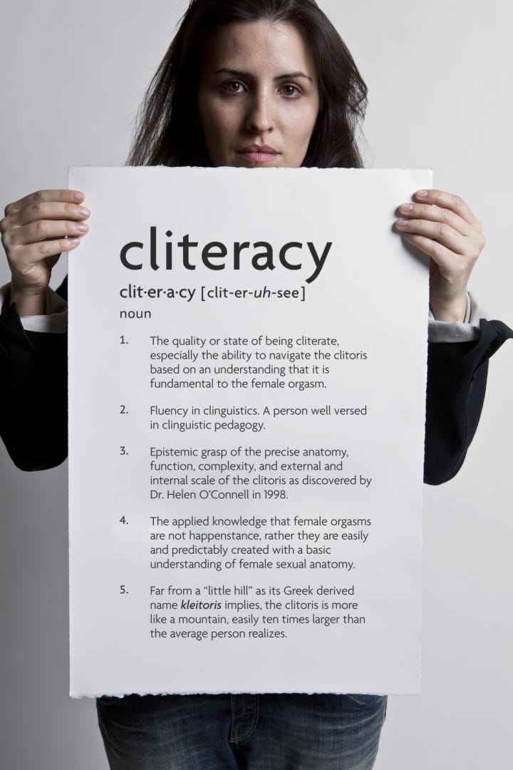 Sophia Wallace holding "Cliteracy (noun)".